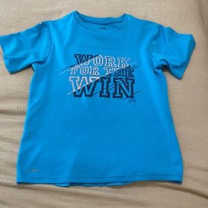 Blue, kids, workout shirt that says “Work for the Win”.